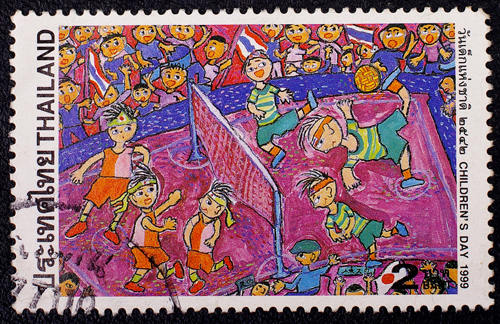 A stamp printed in Thailand shows an image of children playing to commemorate Children's Day, circa 1999.