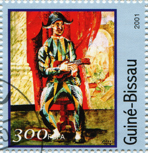 A stamp printed in Guinea-Bissau shows Pablo Picasso’s Harlequin Guitar, Galyamin Sergej